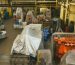 Large covered machinery in a secure industrial warehouse